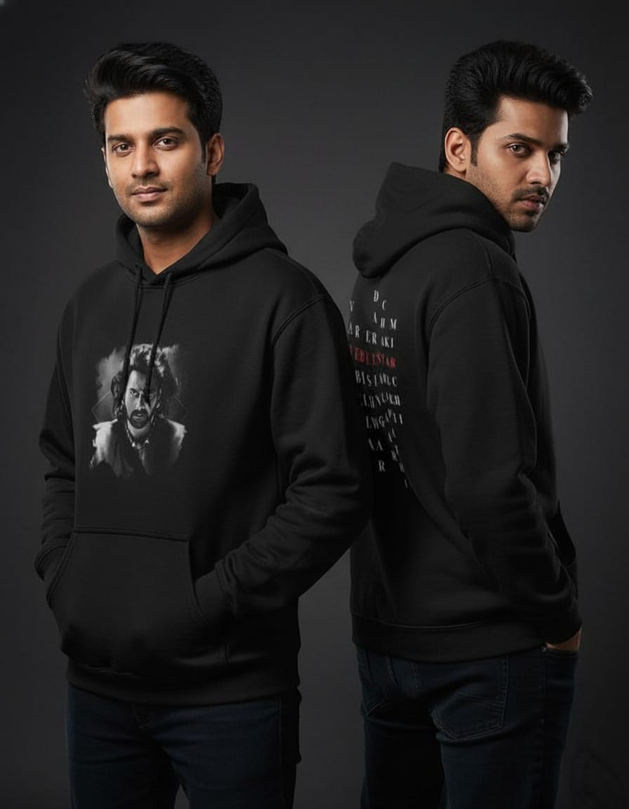 Person wearing a black hoodie with a graphic design on the front and text on the back, standing against a dark background.